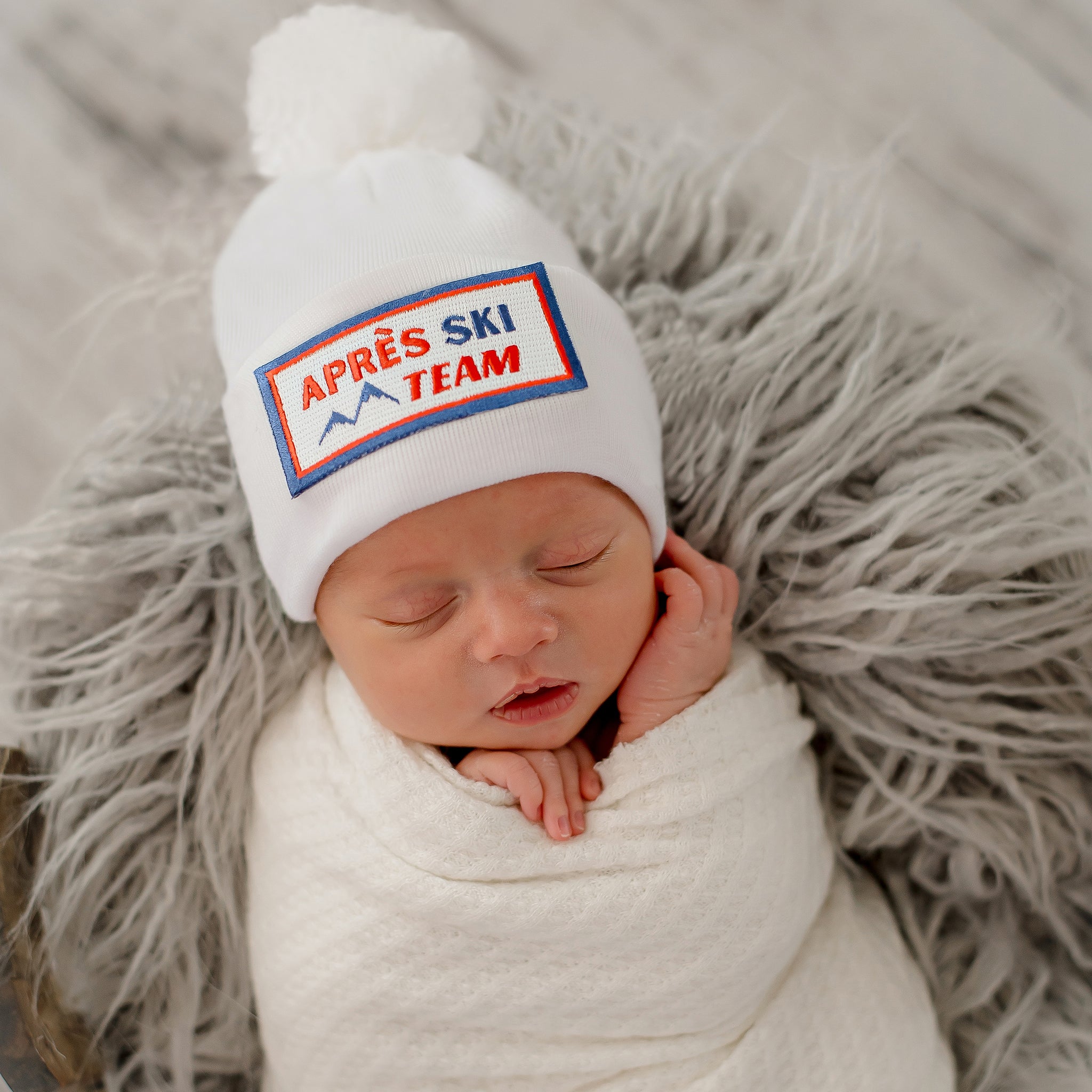 Après Ski Team Baby Hat with White Pom Pom