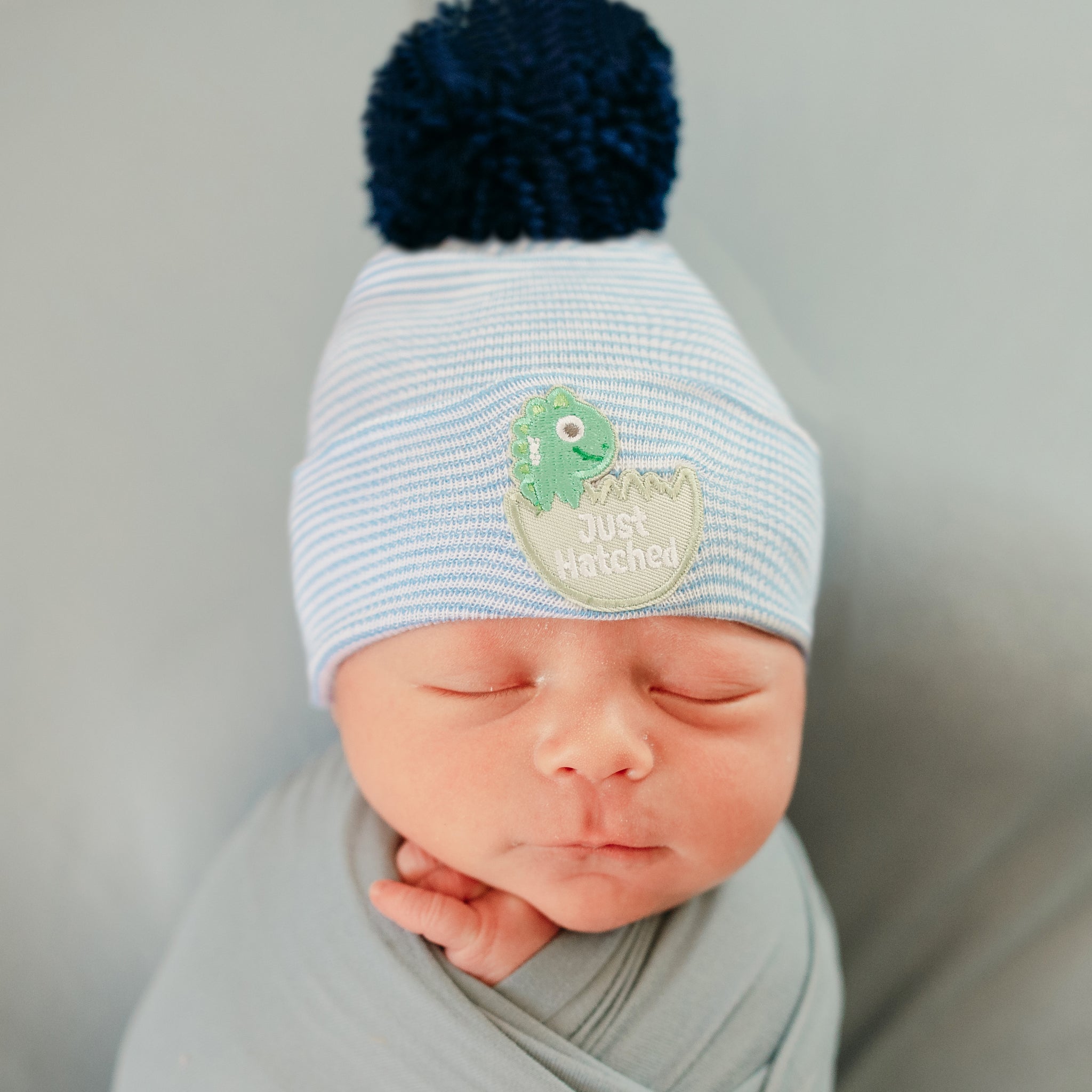 ilybean JUST HATCHED Striped Blue and White Striped Newborn Boy Hospital Hat with Navy Pom